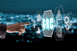 Finger selects GRC interface surrounded by icons for justice, regulation, and risk—representing BankCardLaw’s trusted guidance in navigating complex compliance challenges.